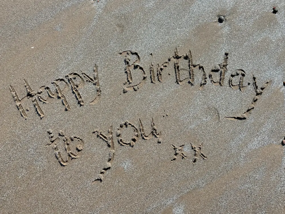 Birthday party activity drawing in sand